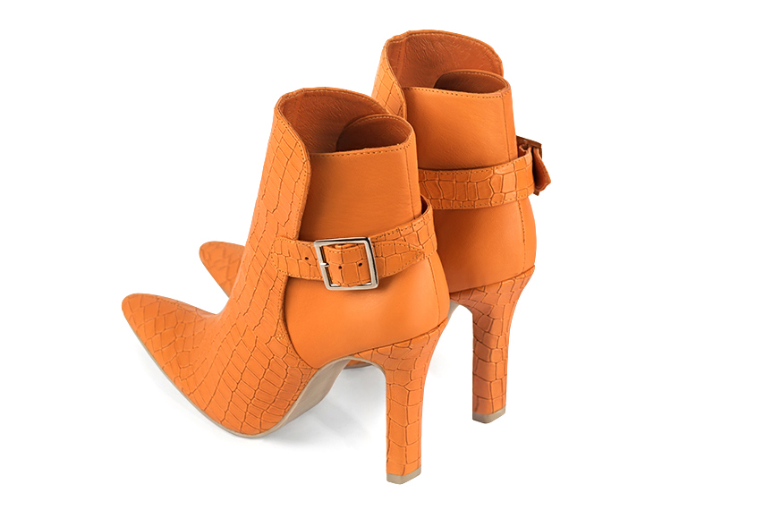 Apricot orange women's ankle boots with buckles at the back. Tapered toe. Very high slim heel. Rear view - Florence KOOIJMAN